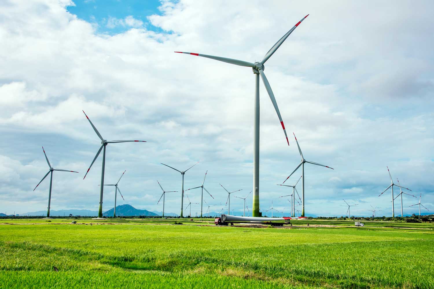 Chris standing up holding his daughter Elva